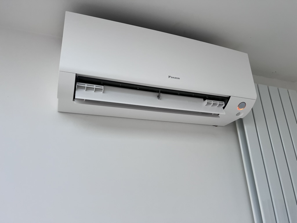 White Daikin wall mounted air conditioning unit fitted by Selec Group for a home near Huntingdon
