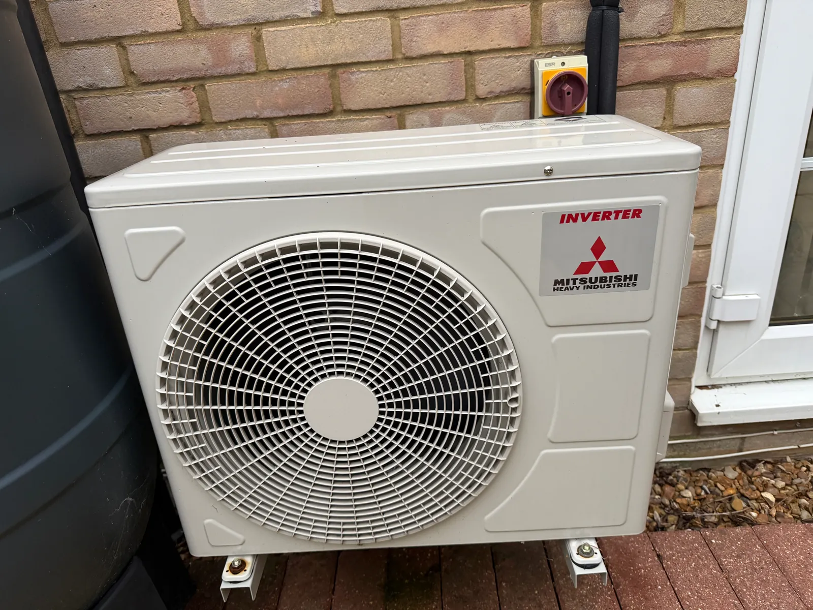 Mitsubishi air conditioning outdoor unit on a patio in Ellington Thorpe, fitted by Selec Group